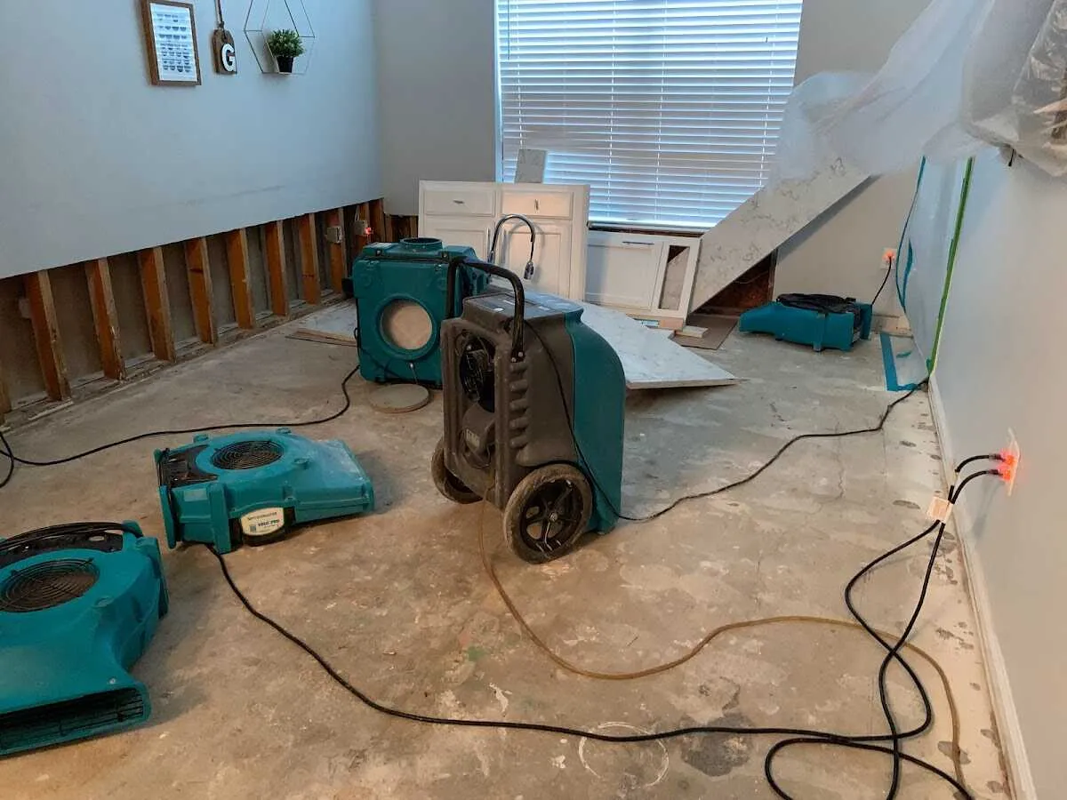Dehumidifier in flood-cut room for Water Damage Restoration in Austin